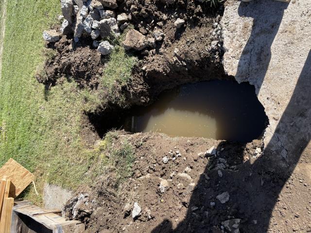 I repaired a broken sewer line for the left side units. I had to dig up and jackhammer concrete to get to the broken pipe. I dug up to where there was good pipe and removed the old pipe. I installed a new pipe and tested the line. There are no leaks, and the line is flowing good. I also snaked out the mainline for the units on the right side.