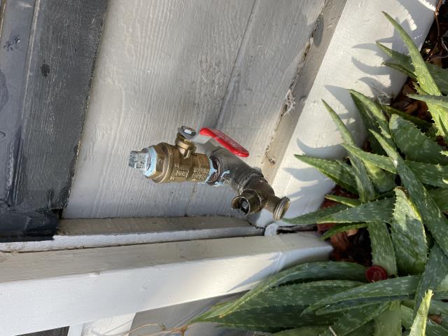 I arrived at the property and found a sprinkler valve leaking and snapped going into the ground. I removed the sprinkler valve and put a 3/4 ball valve with a galvanized plug. I turned the water back on and tested all the faucets and sprinklers, and everything is working properly.