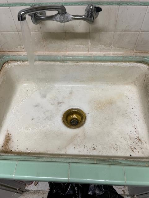 I arrived at the job site to find a clogged kitchen sink. I removed the water and p trap from under the sink and noticed that the metal trap nut on the galvanized nipple had broken into pieces. I ran a kitchen snake down the drain in the wall and pulled back a bunch of sludge from the drain on the snake. I reassembled the drain with a new metal trap nut and ran water into the sink to test. The kitchen sink is now draining properly.