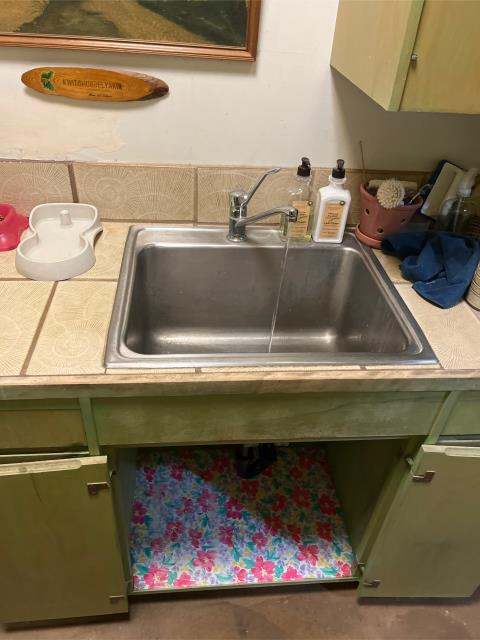 I arrived at the property and found a leaking laundry sink p-trap. I removed the old p-trap and replaced it with a new tailpiece tubular pipe to basket strainer. I ran plenty of water to ensure there were no more leaks.