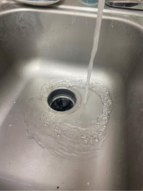 I was called to unclog a kitchen sink that was affecting the dishwasher and garbage disposal side of the sink. Upon inspection, I found that a screw was jamming the garbage disposal, causing the blockage. I removed the screw and unjammed the garbage disposal, allowing it to run and drain properly.