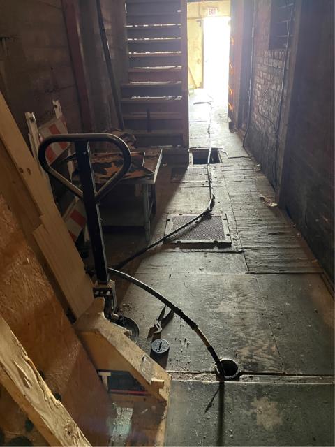 Ran the hydro jetter into the main grease line clean outs in the hallway near the alley behind the restaurant. 
  Ran the hose uphill as far as it would go into the 4” 2 way clean out before the tank multiple times. Then ran it downhill into the tank multiple times to get the line from the restaurant to the grease trap as clear as we could get it. 
  Then ran downhill into the 4” one way clean out after the grease trap. 