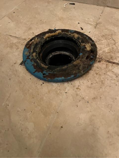 Pulled and reset their back bathroom toilet with our provided wax ring and shims. 
  Found the flange was higher on the right side and would need to be replaced in order to fix the toilet being higher on the right side than the left and too high for the toilet to seat onto the ground properly.  
  Tried to gain authorization from the owner to change out the flange. They chose to leave it as is at this time. 
  Had to use 14 shims, a set of toilet caps, and a 3” wax ring to reseat the toilet. 
  Filled and flushed the toilet multiple times to test. It’s functioning without issue at this time.