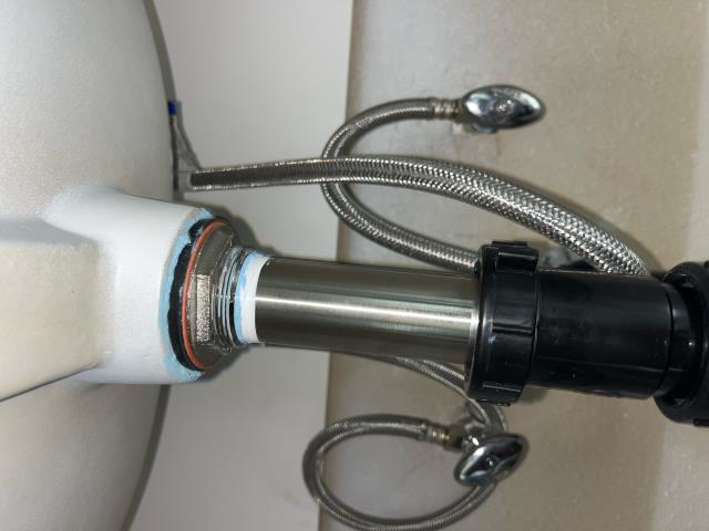 I repaired a pop-up tail piece, which was not fully tight. I removed and replaced the tape and pipe dope, and tested it to ensure it was working properly.