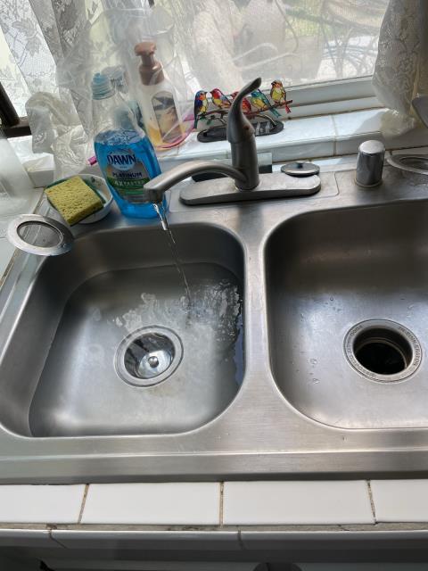 Arrived to property and found kitchen sink clogged. Has clean out on back side wall , used kitchen snake to clear line . Ran whole cable 3 times and cleared line , tested and sink is working properly at this time. Also customer wanted us to check bedroom bathroom toilet and found fill valve leaking , flapper worn and tank to bowl bolts were worn and rusted. Changed out fill valve , flapper and tank to bowl . Tested and all is working properly at this time.