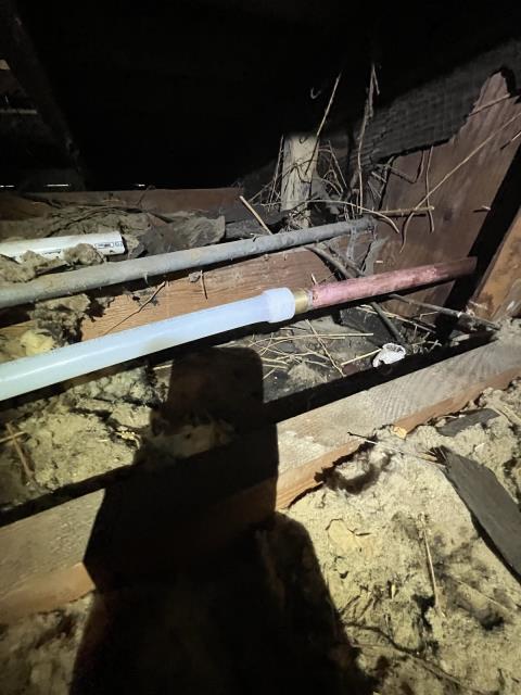 I was called to fix a leak in a living room wall. I found a 1” pvc pipe running from the outside into the wall through the attic and connected to a 1” galvanized pipe. I removed the pvc pipe and replaced it with a 1” copper pipe that was exposed on the outside wall and connected to the existing 1” galvanized pipe with a 1” dialect union. I ran 1” pex through the attic and connected it to the existing 1” galvanized pipe. I strapped and checked for leaks.