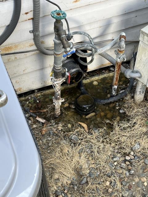 I arrived at the scene to find a clogged sewer line under unit 64. I had to remove the 3" abs union 90 from the drain to access the sewer line. I ran a mainline snake with a 3" grease cutting double blade into the 3" drain under the unit and got the line to flow about 90 feet into the line after fighting through a lot of rough pipe. I pulled back grease and hair on the blade and cable. I ran water into the line from my hose to test, and the sewer line is now draining.