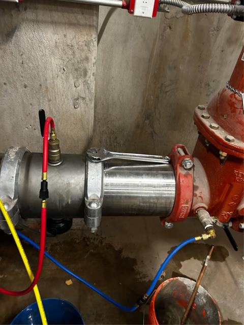 Today we inspected a fire main backflow preventer that was leaking from the relief valve. After disassembling the first check, we found a piece of rubber/silicone lodged in the hinge, which was removed and the check thoroughly cleaned. The backflow preventer was reassembled, retested, and passed inspection. The system was left fully operational, and the fire alarm panel was normal at departure.