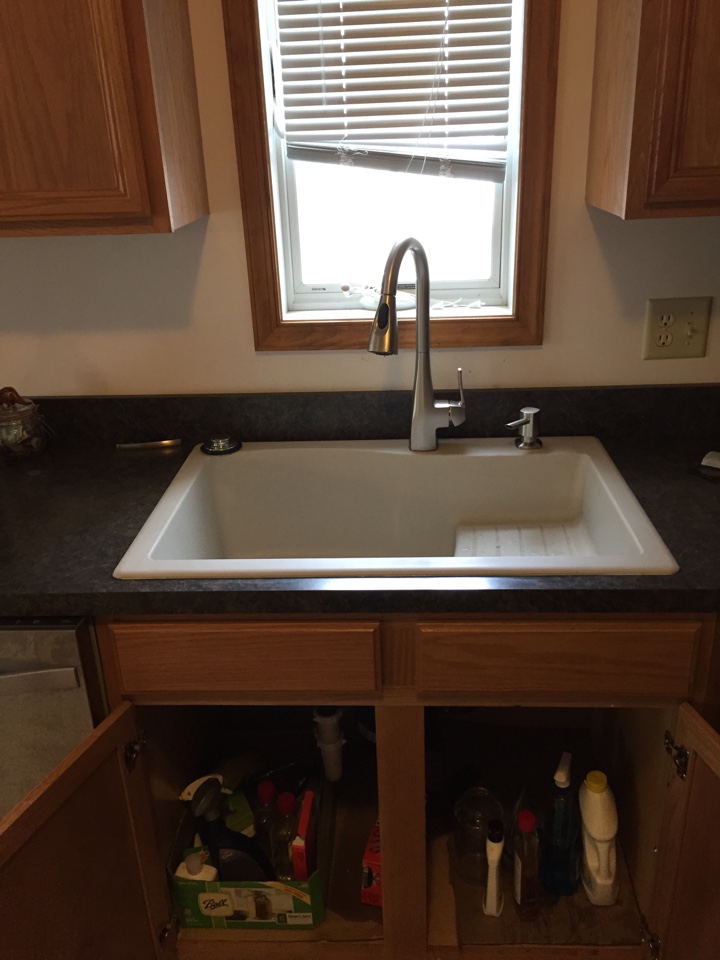 Replaced an old stainless steel kitchen sink with a new sink and a moen kitchen sink faucet and a new ISE garbage disposer.
