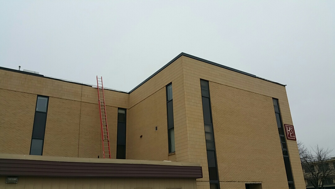 Hays, KS - Installing new fascia metal on a TPO roof project Hays, KS - Installing new fascia metal on a TPO roof project