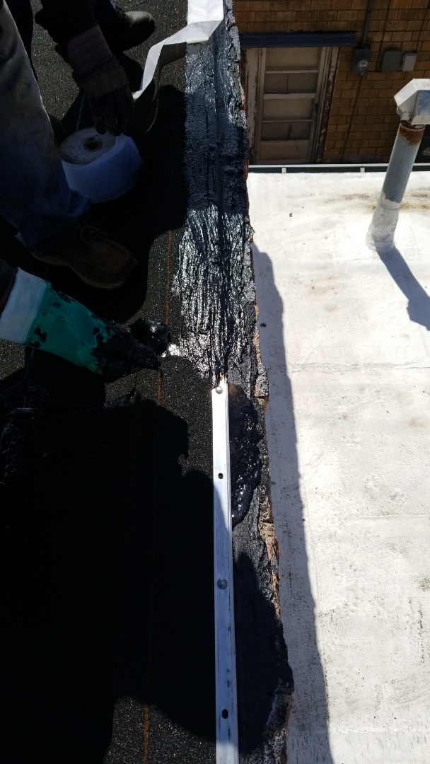 Hays, KS - Waterproofing termination bar at the parapet roof detail. Many times this is overlooked by other contractors who are inexperienced. Hays, KS - Waterproofing termination bar at the parapet roof detail. Many times this is overlooked by other contractors who are inexperienced.