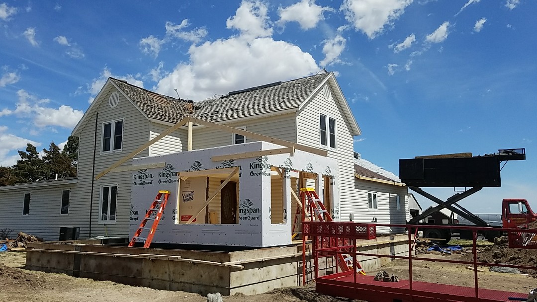 Ellis, KS - The guys are working hard on this beautiful day to complete a 74 sq. Malarkey roof install. This 100 year old farm was stripped of its original wood shakes and replaced with one of the best impact resistant roofs on the market. Ellis, KS - The guys are working hard on this beautiful day to complete a 74 sq. Malarkey roof install. This 100 year old farm was stripped of its original wood shakes and replaced with one of the best impact resistant roofs on the market.