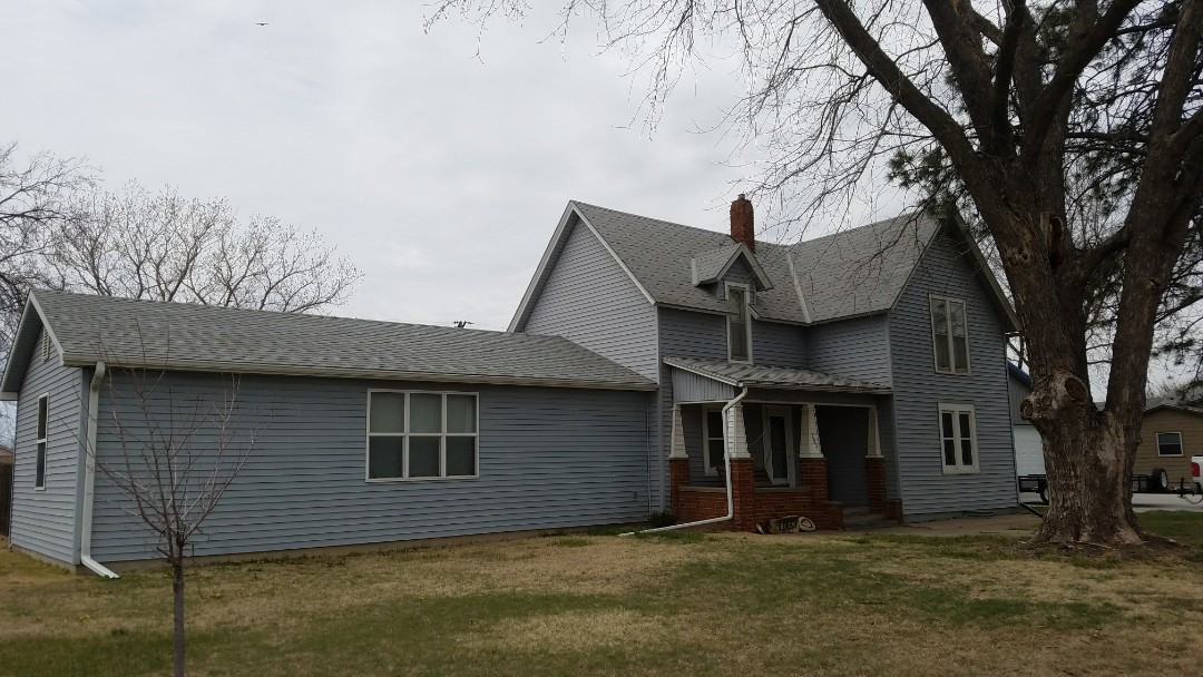 Claflin, KS - Working in Claflin this afternoon. This 30 year old T-Loc shingle roof has been through many storms and its ready to be updated with a newer durable roof. Claflin, KS - Working in Claflin this afternoon. This 30 year old T-Loc shingle roof has been through many storms and its ready to be updated with a newer durable roof.