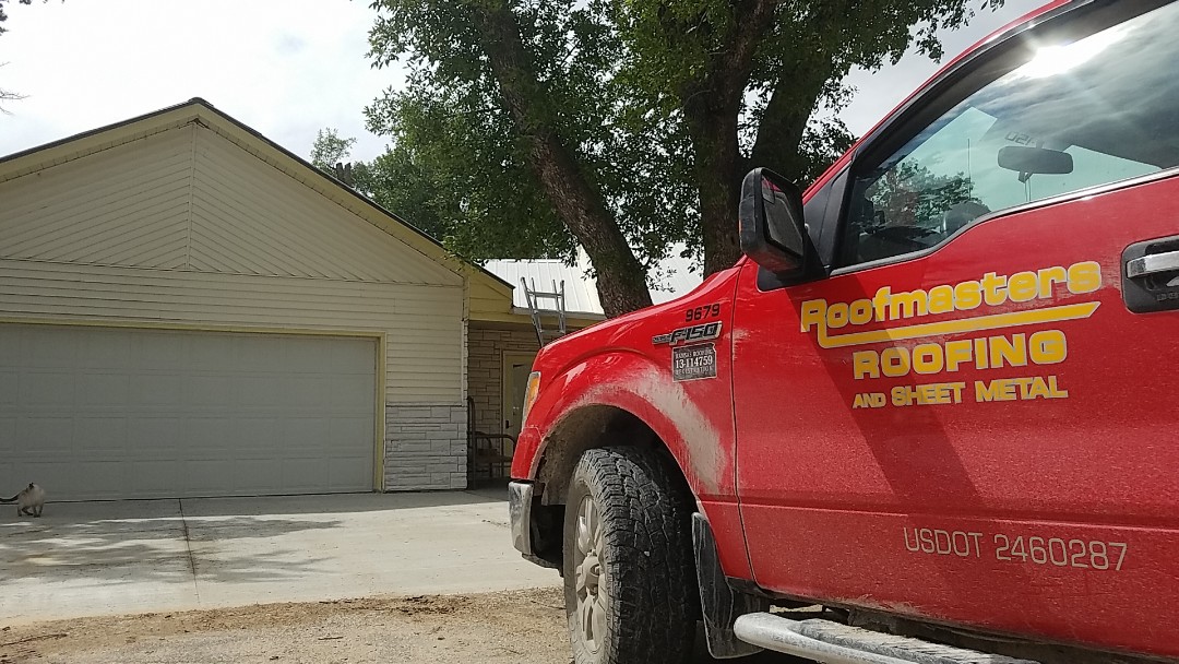 Osborne, KS - Just ahead of the storms measuring up this beautiful farmhouse for a new 24 gauge standing seam roofing system. Osborne, KS - Just ahead of the storms measuring up this beautiful farmhouse for a new 24 gauge standing seam roofing system.