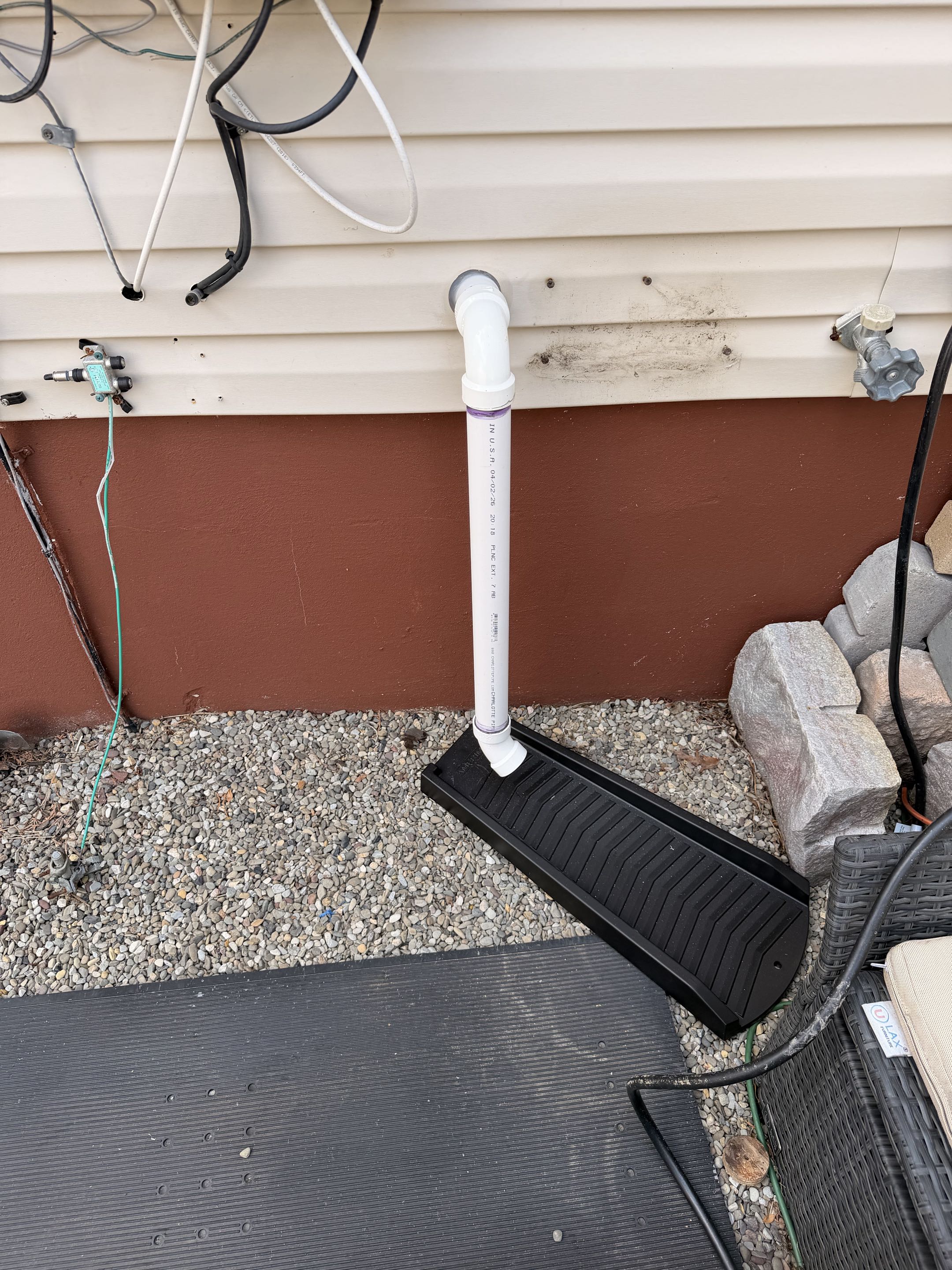 Sump pump was tied into the main sewer line causing sore gas odors re-piped to the outside and connected drain