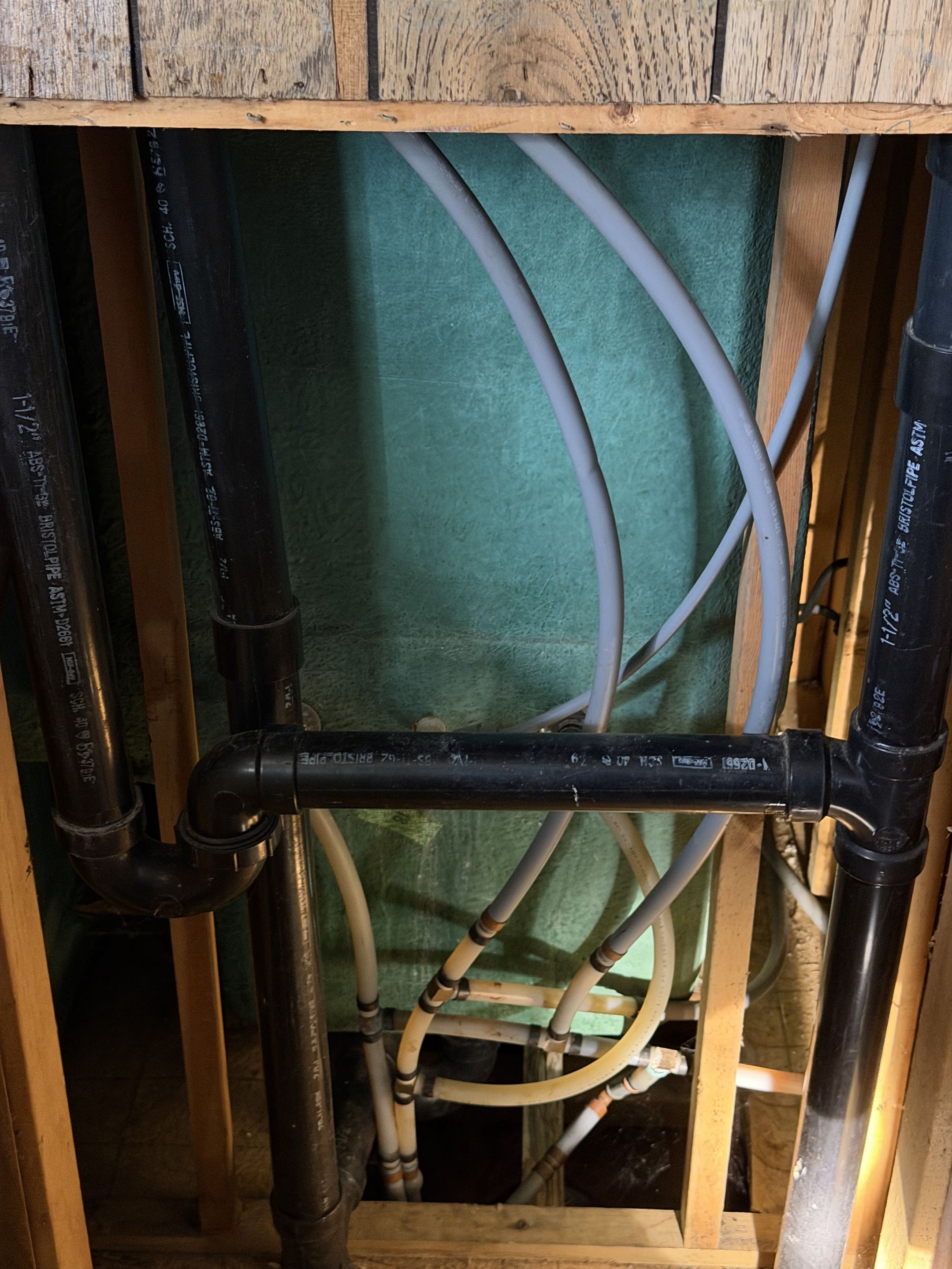 Performing a whole foam re-pipe of all the domestic water pipe in the home it is the old outlawed gray plastic piping replacing with all new uponor pex A piping. 