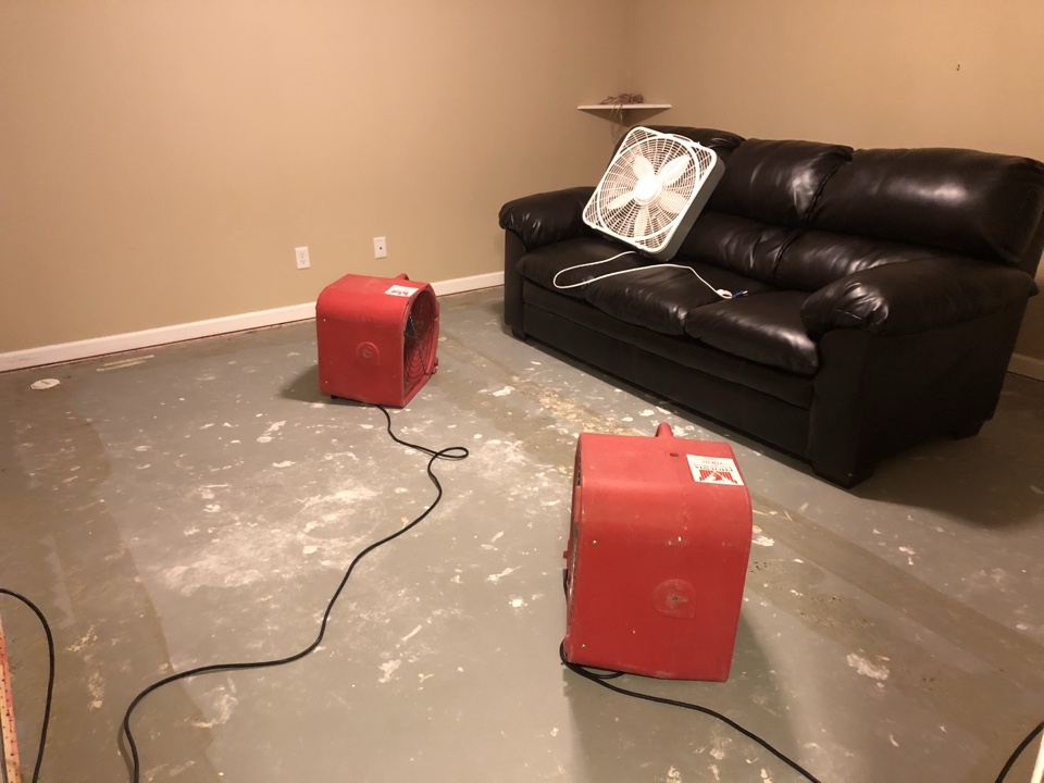 Hudsonville, MI - Hot water heater and sump pump failure. Removed carpet and pad. Treat floor with microban. Set up air movers and dehumidifier to dry the basement walls and concrete floors Hudsonville, MI - Hot water heater and sump pump failure. Removed carpet and pad. Treat floor with microban. Set up air movers and dehumidifier to dry the basement walls and concrete floors
