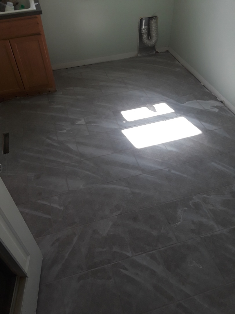 Allendale Charter Township, MI - Terrible picture. It doesn't show but I grouted the floor today. You can see a haze on the floor. I will buff that off tomorrow before I install the trim work. Allendale Charter Township, MI - Terrible picture. It doesn't show but I grouted the floor today. You can see a haze on the floor. I will buff that off tomorrow before I install the trim work.