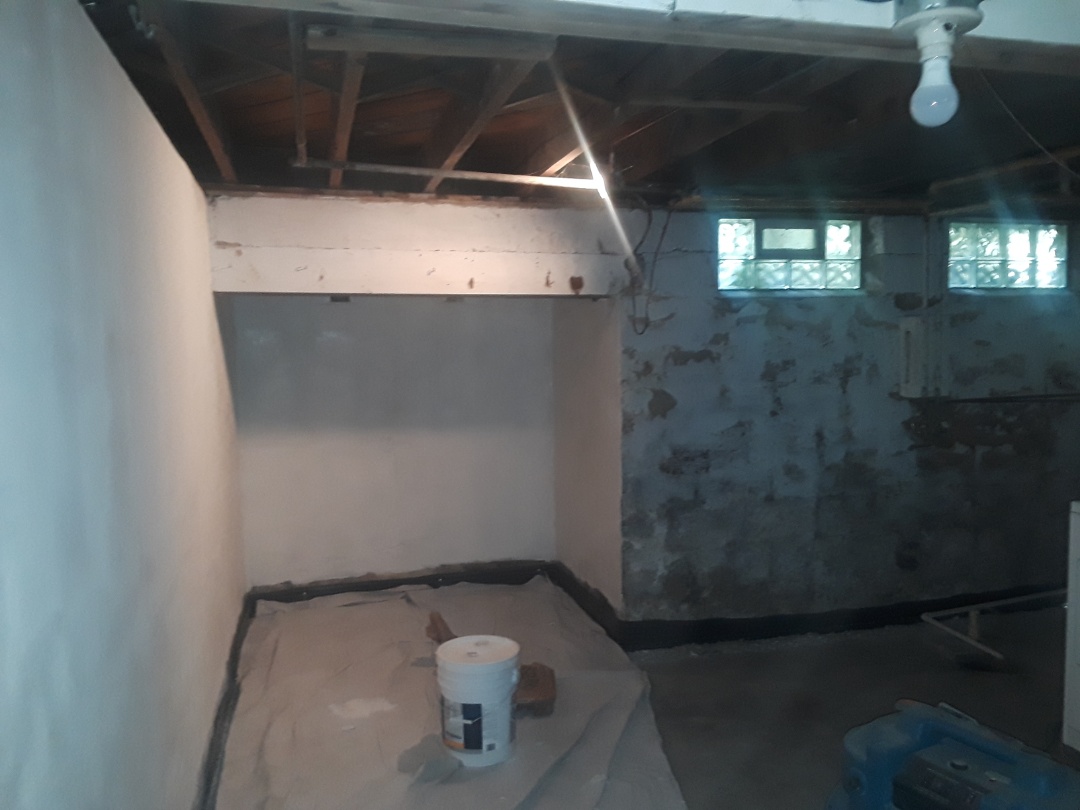 Grand Rapids, MI - Almost have "blockfiller" primer finished. It's slow to apply, but fills in most of the divots, pits and holes found in old basement walls. Grand Rapids, MI - Almost have "blockfiller" primer finished. It's slow to apply, but fills in most of the divots, pits and holes found in old basement walls.