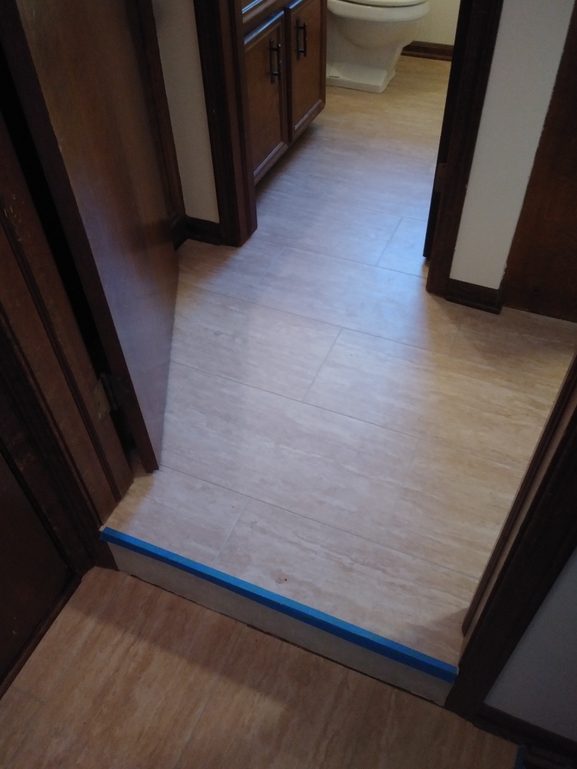 Wyoming, MI - Finished laminate floor today. I provided a different view. I removed the toilet then reset it after I finished installing the floor. I also reinstslled the shoe and toe moldings throughout. The blue tape is present because I am waiting on stair nosing. As soon as it comes in I will be back to install that as well. Wyoming, MI - Finished laminate floor today. I provided a different view. I removed the toilet then reset it after I finished installing the floor. I also reinstslled the shoe and toe moldings throughout. The blue tape is present because I am waiting on stair nosing. As soon as it comes in I will be back to install that as well.