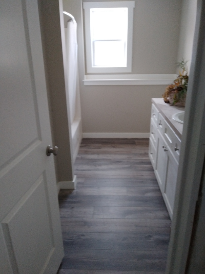 Walker, MI - Finished laying the floor in the bathroom Walker, MI - Finished laying the floor in the bathroom