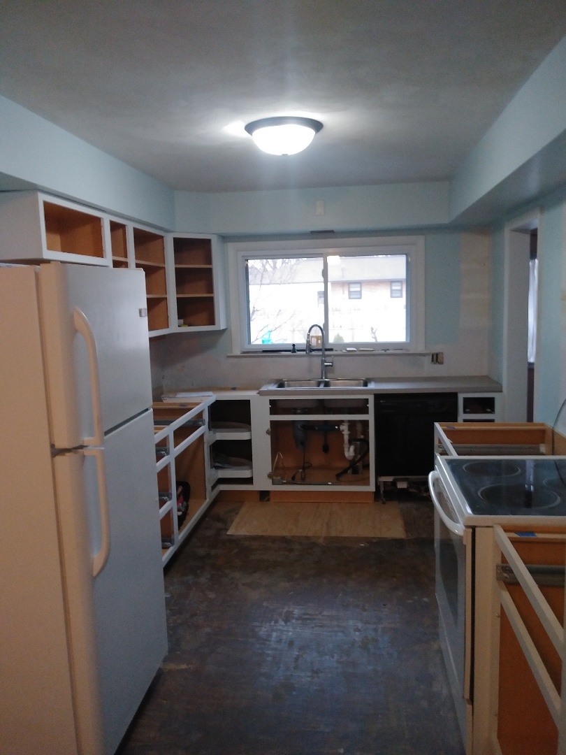Holland, MI - Installed most of the cabinet boxes today. Also reinstalled the dishwasher, a temporary countertop and temporary sink. It takes about 8 - 10 weeks to get a new countertop these days and we don't want to leave them without a functional kitchen. Holland, MI - Installed most of the cabinet boxes today. Also reinstalled the dishwasher, a temporary countertop and temporary sink. It takes about 8 - 10 weeks to get a new countertop these days and we don't want to leave them without a functional kitchen.