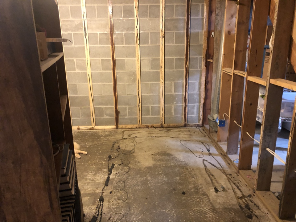 Muskegon, MI - Water restoration repair work to the basement living room. Paneling replacement and flooring Muskegon, MI - Water restoration repair work to the basement living room. Paneling replacement and flooring