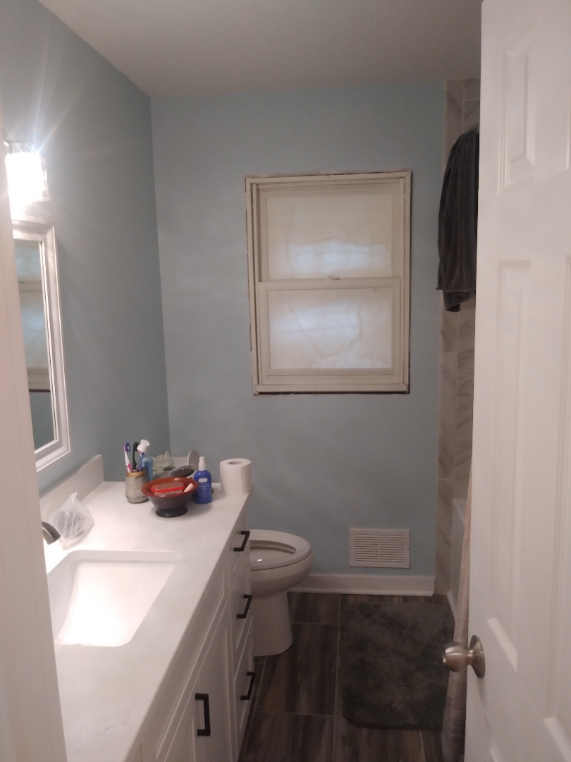 Grand Rapids, MI - Finished bathroom ( except for new window. It's on order) new drywall, paint, vanity, counter, light fixture, tub, valve, tile surround and new tile floor. Grand Rapids, MI - Finished bathroom ( except for new window. It's on order) new drywall, paint, vanity, counter, light fixture, tub, valve, tile surround and new tile floor.