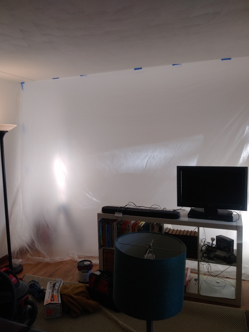 Grand Rapids, MI - Hung plastic to contain the dust I'm about to make sanding the wall I skim coated Grand Rapids, MI - Hung plastic to contain the dust I'm about to make sanding the wall I skim coated
