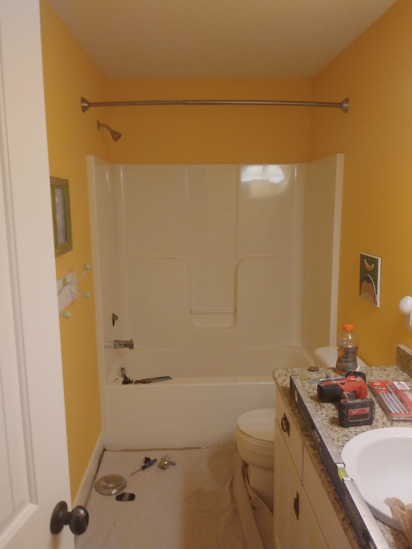 Grand Rapids, MI - Starting the demo of a fiberglass bathtub unit. The bottom of the tub is cracked and leaking into the main floor living room Grand Rapids, MI - Starting the demo of a fiberglass bathtub unit. The bottom of the tub is cracked and leaking into the main floor living room