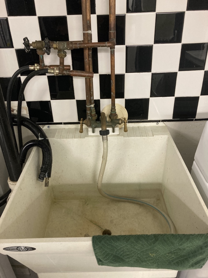 Plumber. Laundry faucet repair and replacement 