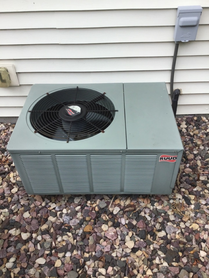 Preventative maintenance on a Ruud air conditioner. 