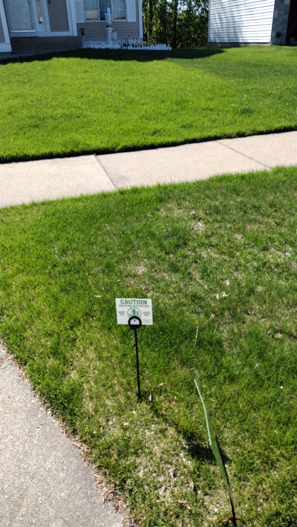 applying crabgrass control 