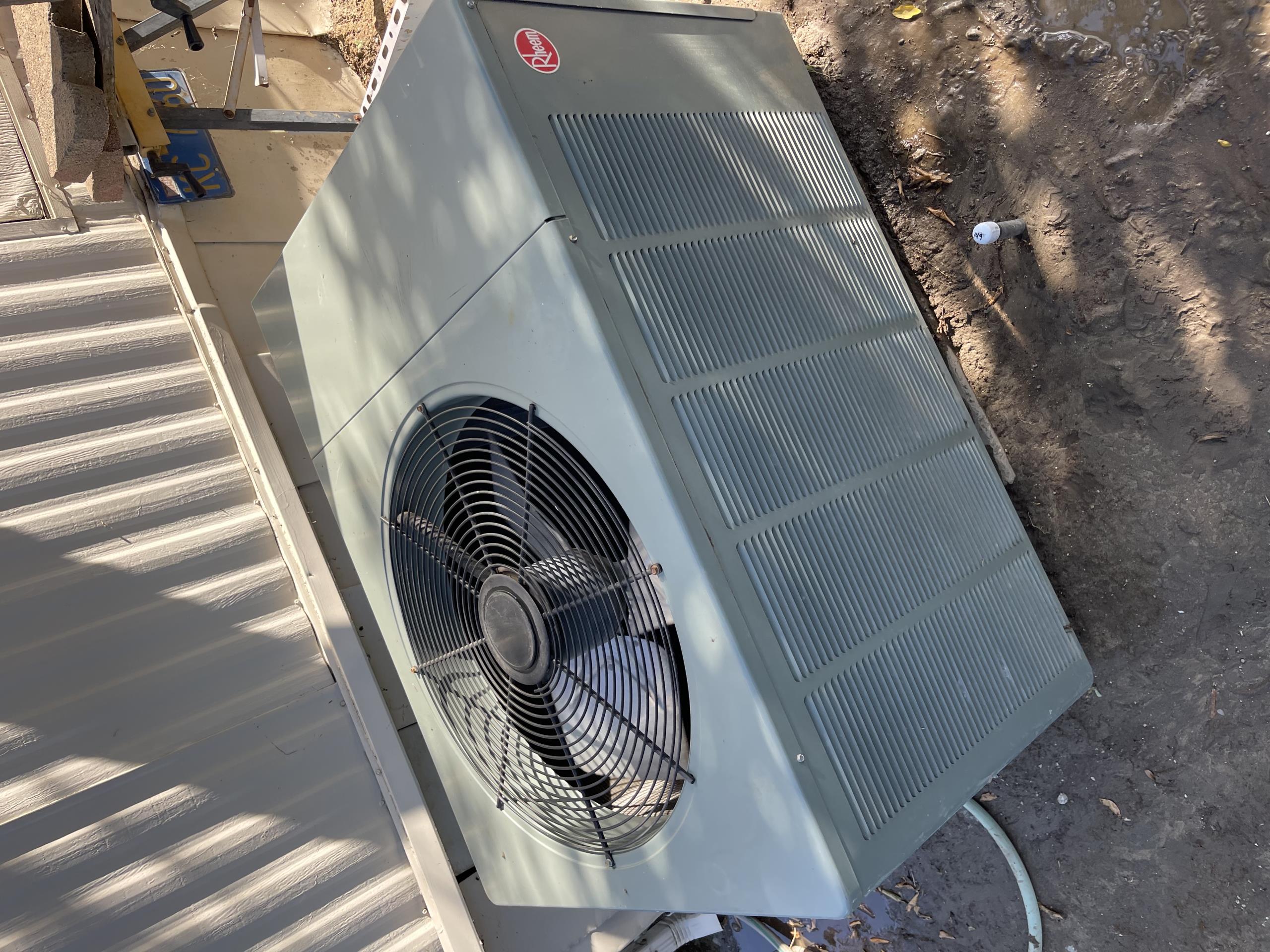 The Rheem unit was manufactured in 2005 and had a cycle in both cooling and heating. The motors were in fair condition, and the washable filter was washed out. Most of the electrical components were within the manufacturer's specifications. The condenser coil was washed out, and the blower wheel compartment was dirty. The added weight will unbalance the blower wheel. The condenser was getting excessively hot, and the blower motor was recommended to be replaced soon.