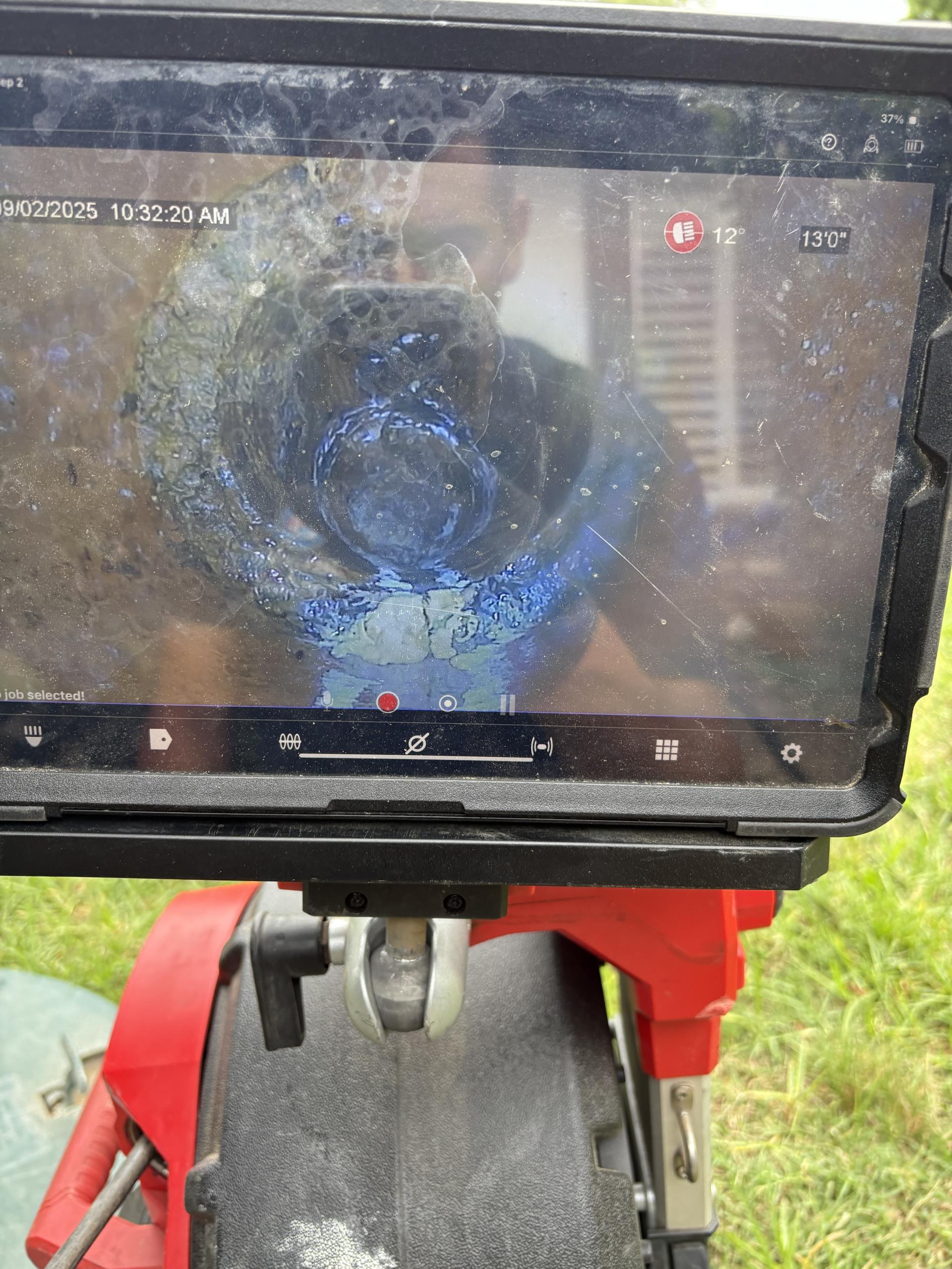 I was called to a home in the suburbs to repair a backed-up main line. I used a snake to clear the line, but it was still not flowing properly. I then used hydro jetting to clean the line from upstream through the septic tank. Afterward, I ran a camera to check for any structures in the main line. There were no structures, so I provided a one-year warranty.