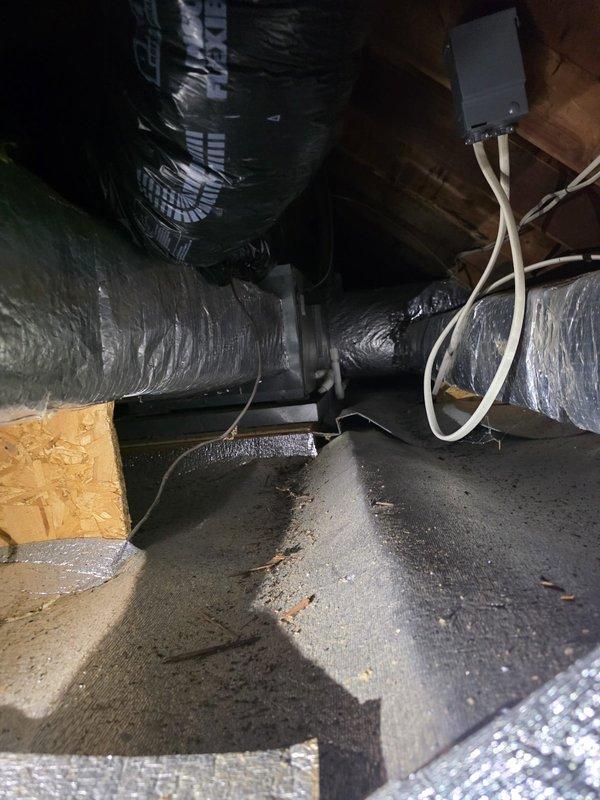 Completed comfort call consultation for heat pump replacement evaluation. Inspected existing HVAC system located in attic space, documenting current ductwork configuration with insulated flexible ducts, electrical connections, and PVC condensate drainage lines. Photographed attic installation conditions to assess replacement requirements and provide accurate system sizing recommendations.