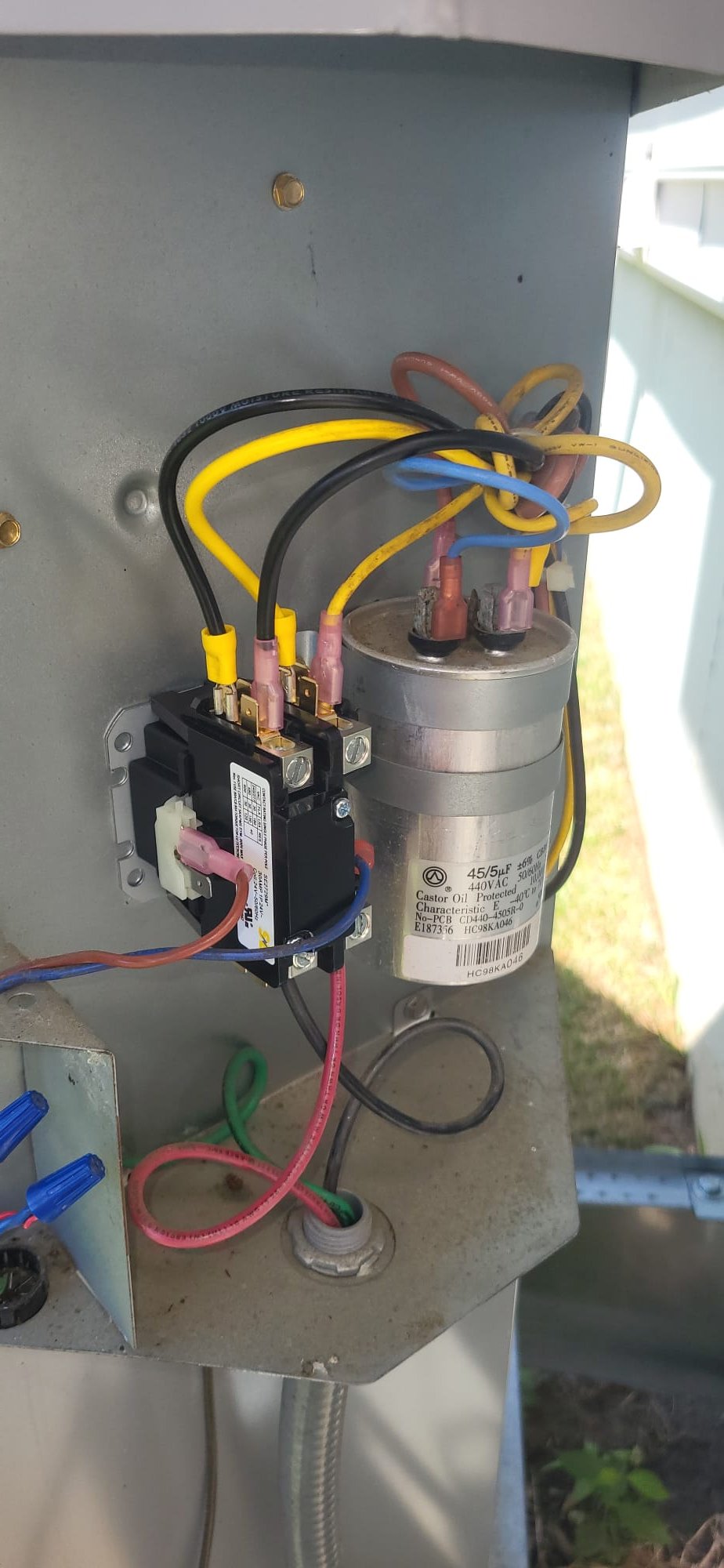 I conducted a thorough HVAC rejuvenation cleaning, including inspecting the air conditioning system. The blower wheel was clean and spinning freely. Static pressure was recorded at.98 in. w.c. with a 23°F Delta T. The voltage distribution system was below spec with 10 ohms of resistance and pitted contacts, so it was replaced. The refrigerant pumping system passed the megaohm test, but the LRA was above spec, so a performance enhancement system was recommended. All electrical connections were secure.