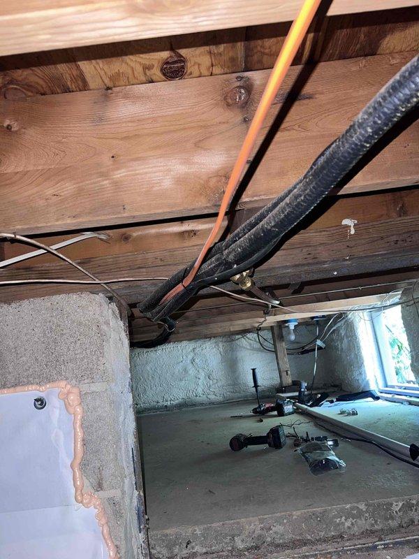 Installed structural anchors and support straps to secure deck framing to exterior wall per management specifications. Verified proper attachment of pressure-treated lumber framework to building structure using metal brackets and fasteners. Inspected crawl space and attic areas to assess structural connections and documented installation with photographic evidence.