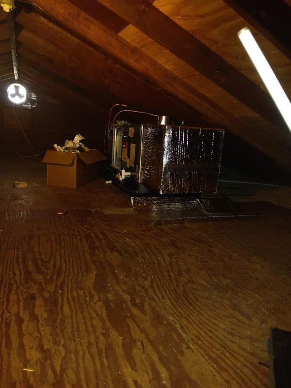 Completed installation of new HVAC air handler unit in attic space. Positioned equipment on prepared plywood flooring, secured all refrigerant line connections, and wrapped unit with reflective insulation for optimal thermal efficiency. Performed system startup and testing procedures on outdoor condensing unit, utilizing digital manifold gauges to verify proper refrigerant pressures and system operation. All electrical connections completed to manufacturer specifications and system confirmed operational.