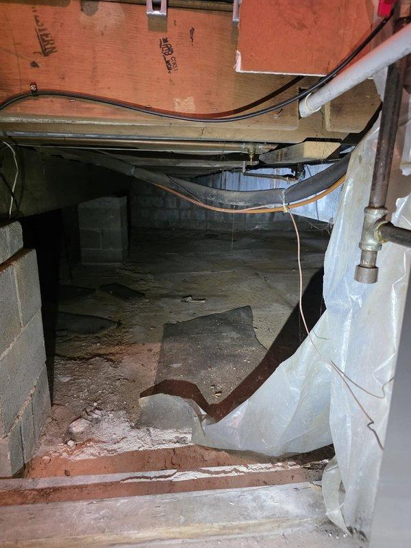 Completed comfort call inspection of HVAC system and crawl space area. Documented existing conditions including sagging ductwork, exposed electrical wiring along floor joists, moisture staining on concrete floor, and loose insulation material. Photographed electrical panel showing available breaker capacity and current circuit configuration. Advised on observed deficiencies requiring attention for proper system operation and safety compliance.