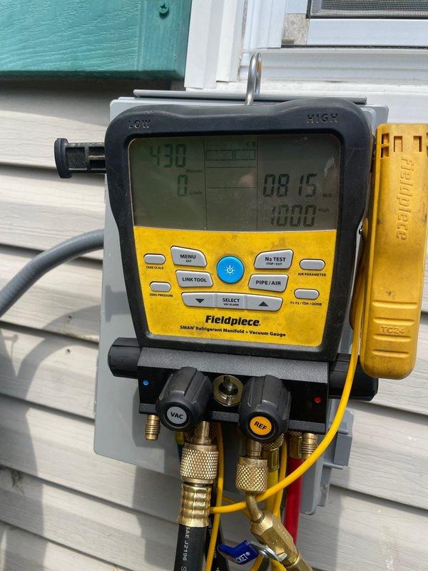 # Return for Installation Error

Responded to a warranty return for an HVAC installation error occurring within the six-month warranty period. Upon arrival, identified a faulty copper refrigerant line connection that had been improperly installed during the original system setup. The copper fitting showed premature oxidation and discoloration inconsistent with normal aging, indicating installation defects.

Removed the defective copper connector assembly from the outdoor condensing unit. Utilized Fieldpiece SMAN refrigerant manifold gauge set to verify system pressures and diagnose refrigerant line issues. Readings confirmed abnormal pressure levels resulting from the compromised connection. Replaced the faulty copper fitting with properly sized components and executed correct brazing procedures to ensure leak-free joints. Evacuated the system using appropriate vacuum procedures, then recharged with manufacturer-specified refrigerant to proper levels. Verified all connections tested le