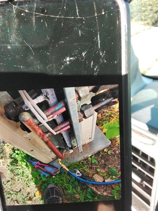 Responded to a recall on the outdoor condensing unit and inspected the refrigerant line set, noting oxidized copper lines, deteriorated insulation, and flare connections at the service valves. Connected gauge manifold hoses to the service ports and used hand tools to service and tighten the fittings and line connections, then verified the unit for proper operation.