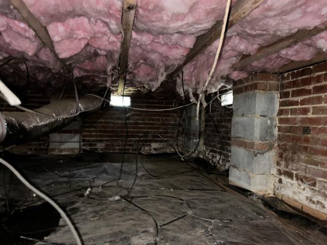 We completed a crawl space moisture and humidity control project to help create a cleaner, drier environment beneath the home. Our team cleaned out the crawl space, installed a durable 12-mil vapor barrier, added foundation vent covers, and installed a crawl space dehumidifier near the center of the space for effective humidity control.