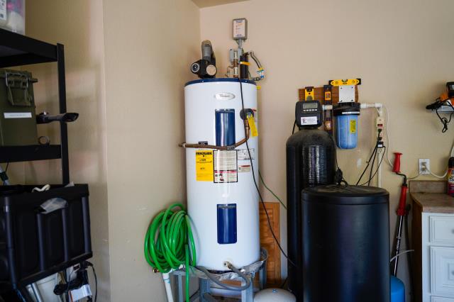 I recently completed a job as a plumber. I supplied and installed a new 50-gallon Bradford White tank-style natural gas, gravity water heater. I removed and disposed of the old tank. I supplied and installed a new 3/4" cold water shut-off valve. I installed new water heater pans, gas flex lines, and a full-port drain valve with a hose connection. I also upgraded the drain valve to a full-port drain valve with a hose connection. 