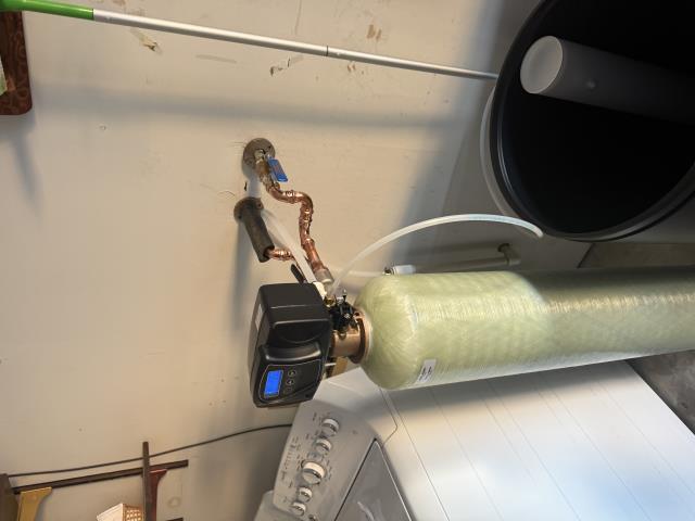 Supply and install new Brass Master Standard BT 32 Water Softener (top picture. Remove and dispose of the old blue softener. Install to existing water softener loop, and existing drain for softener.