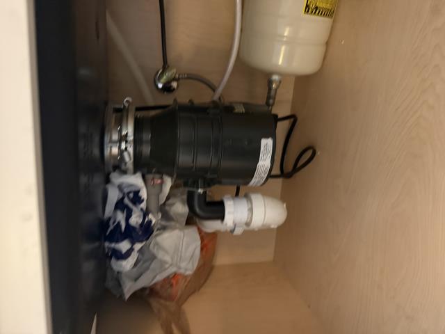 I removed the non-functional garbage disposal and installed a reliable 1/2 HP Wolverine Brass model, ensuring smooth waste processing.