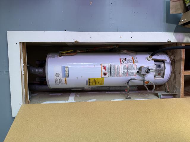 I replaced an old water heater with a new 50-gallon Bradford White model, installed a shut-off valve, and upgraded the drain valve. I also installed new copper water lines and a gas flex line, and set the expansion tank pressure.