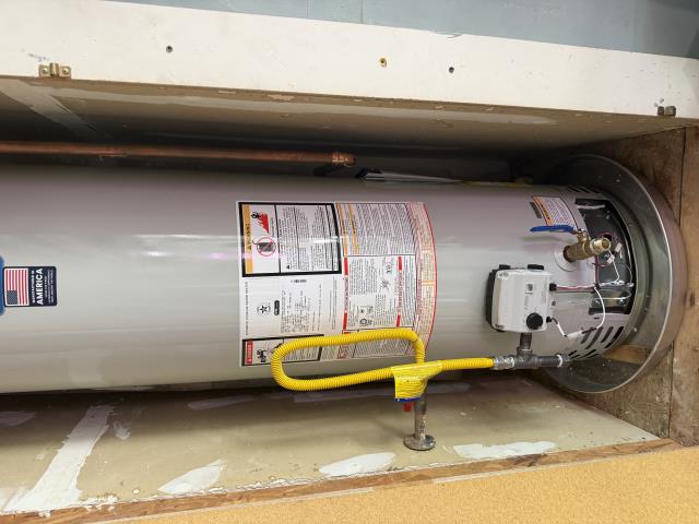 I replaced an old water heater with a new 50-gallon Bradford White model, installed a shut-off valve, and upgraded the drain valve. I also installed new copper water lines and a gas flex line, and set the expansion tank pressure.