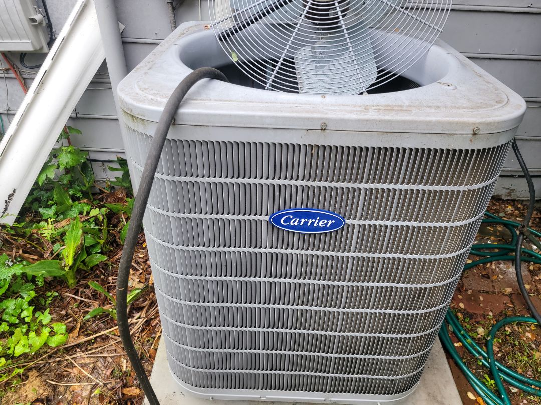 Marietta, GA - performed AC Maintenance on a Carrier Infinity Condensing Unit and removed all debris from bottom of condensing unit.  Marietta 