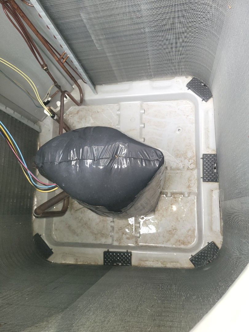 Marietta, GA - Performed AC Maintenance on 2 Infinity Carrier Condensing Units and removed all debris from bottom of condensing Units.  Marietta 